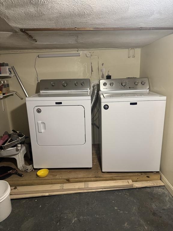 laundry room with washer and clothes dryer