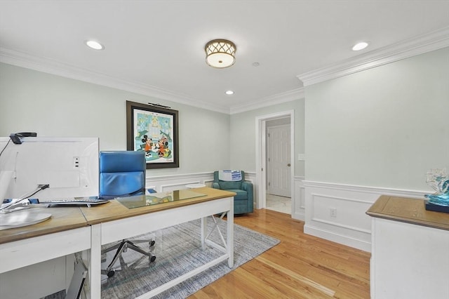 home office with light wood-style flooring, a wainscoted wall, crown molding, and recessed lighting