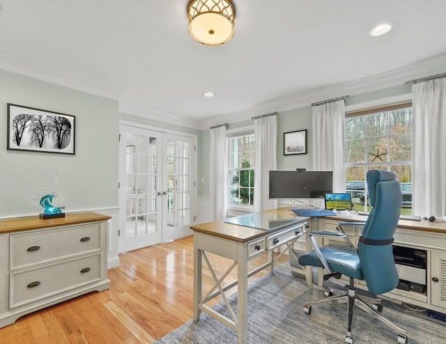 office space featuring french doors, wainscoting, ornamental molding, and light wood-type flooring