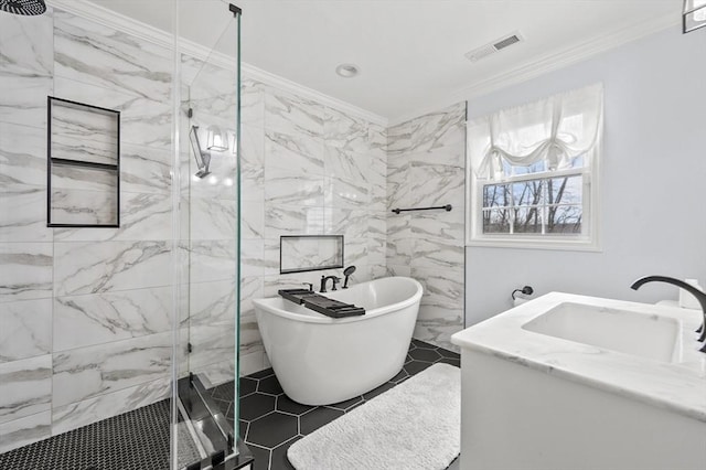full bath with a marble finish shower, a sink, crown molding, and visible vents