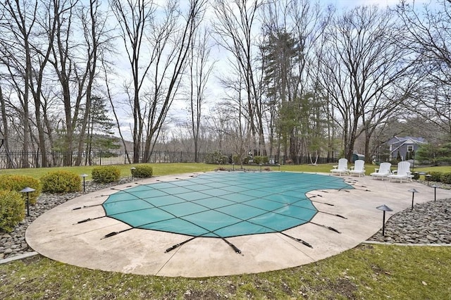 view of pool with a yard, a fenced in pool, fence, and a patio
