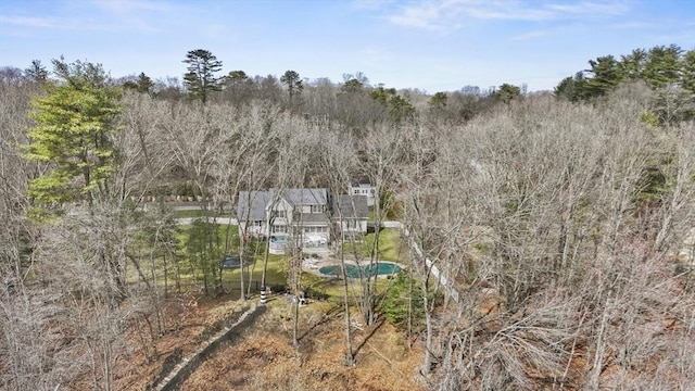 drone / aerial view featuring a forest view