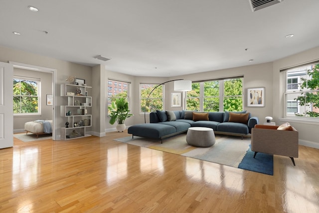 living room with light hardwood / wood-style floors