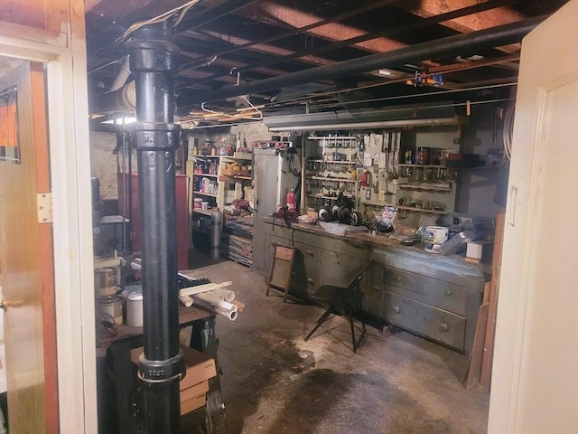 190 Ennell St, Lowell, MA 01850 - unfinished below grade area with a workshop area