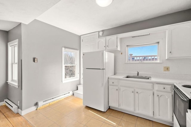 kitchen with a sink, white cabinetry, white appliances, a baseboard radiator, and baseboard heating