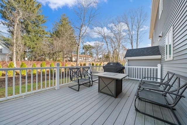 deck featuring a grill and fence