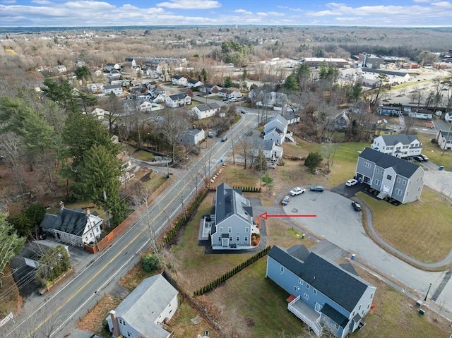 birds eye view of property with a residential view