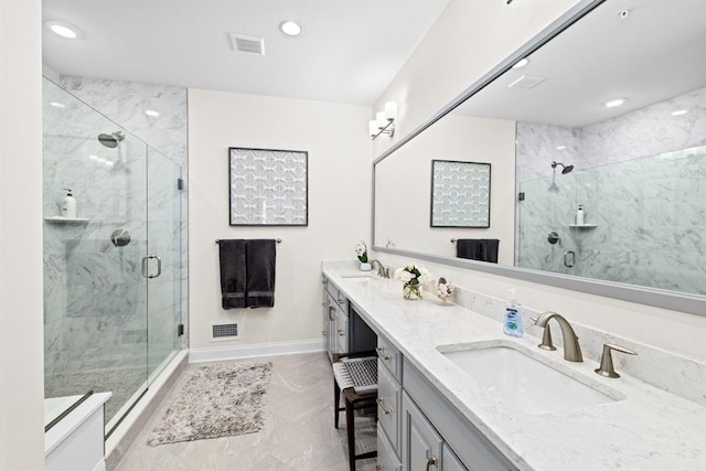 5 Diane Ter Unit 5, Scituate, MA 02066 - full bath featuring a marble finish shower, double vanity, recessed lighting, and marble look tiles