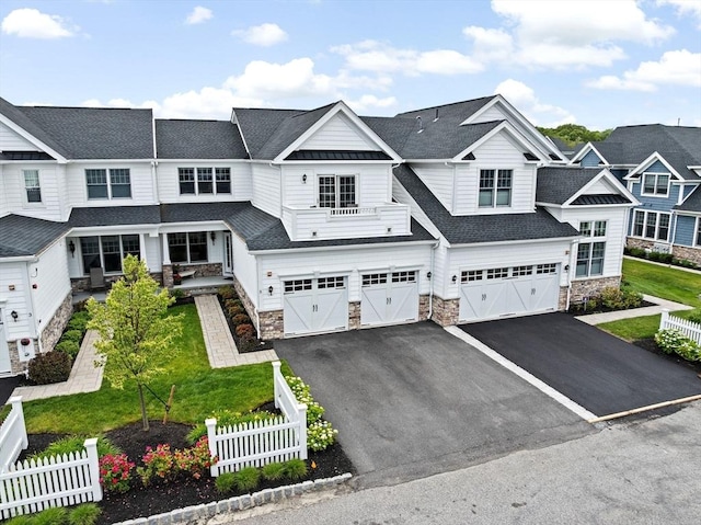 5 Diane Ter Unit 5, Scituate, MA 02066 - view of front facade featuring stone siding, asphalt driveway, an attached garage, and roof with shingles