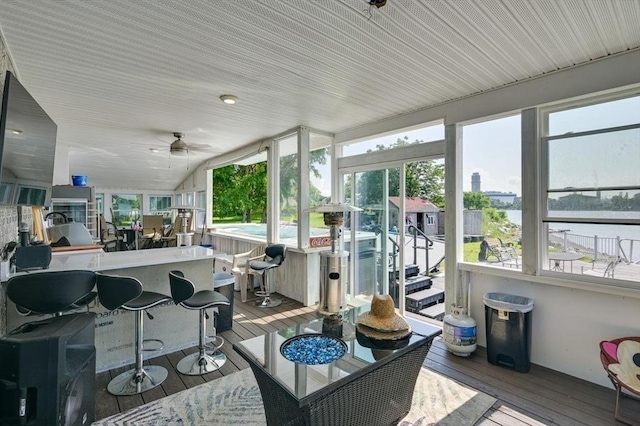 104 Kings Cove Beach Rd, Weymouth, MA 02191 - sunroom / solarium featuring healthy amount of natural light, hardwood / wood-style flooring, and a deck with water view