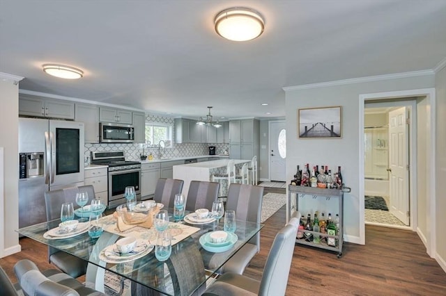 104 Kings Cove Beach Rd, Weymouth, MA 02191 - dining area featuring ornamental molding, dark wood-type flooring, a chandelier, and recessed lighting