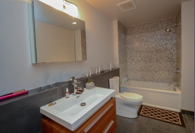 691 Massachusetts Ave Unit 102, Boston, MA 02118 - bathroom featuring vanity, shower / washtub combination, and tile patterned floors