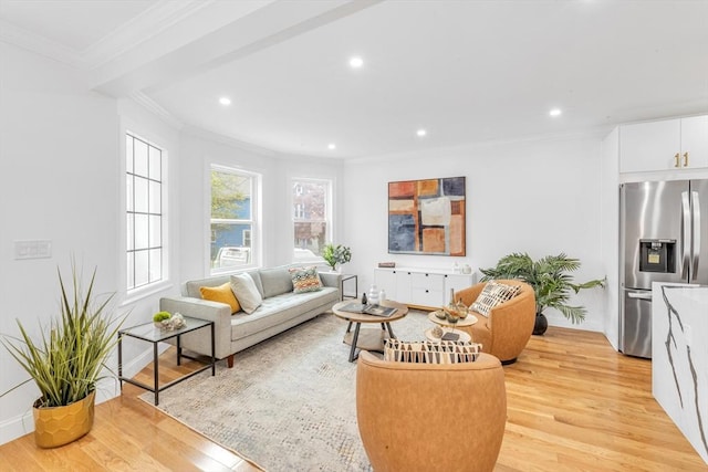 living room featuring light wood-style flooring, ornamental molding, recessed lighting, and baseboards