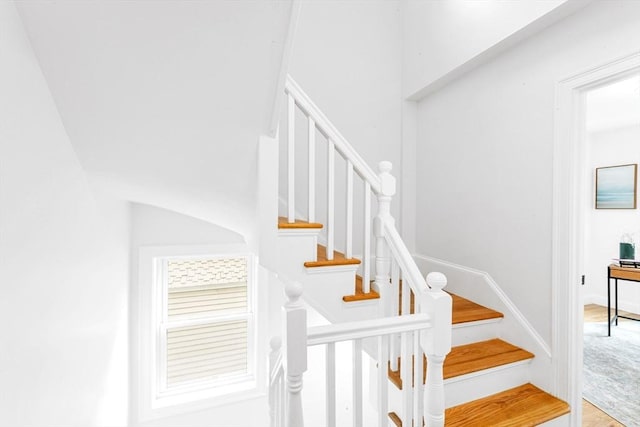 stairs with wood finished floors
