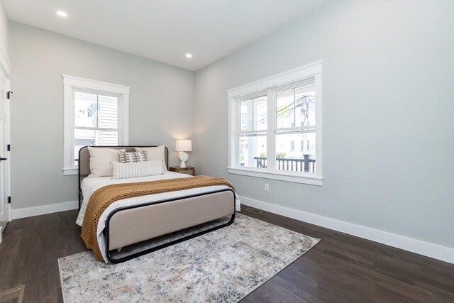 bedroom with recessed lighting, baseboards, and dark wood-style floors