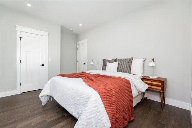 bedroom with baseboards, recessed lighting, and wood finished floors