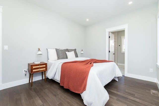 bedroom with visible vents, recessed lighting, dark wood finished floors, and baseboards