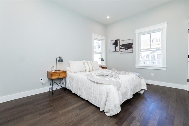 bedroom featuring dark wood-style flooring, baseboards, and recessed lighting