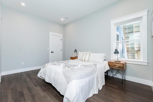 bedroom featuring recessed lighting, baseboards, and dark wood finished floors