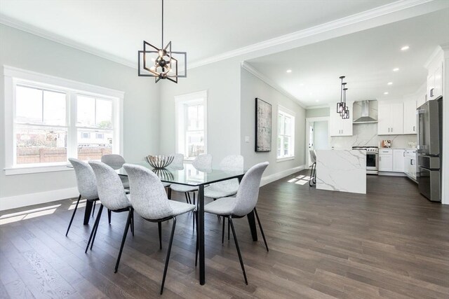 dining room featuring dark wood-type flooring, ornamental molding, baseboards, and a notable chandelier