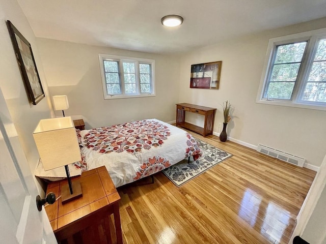 17 Brentwood Rd, Sudbury, MA 01776 - bedroom featuring visible vents, multiple windows, baseboards, and wood finished floors