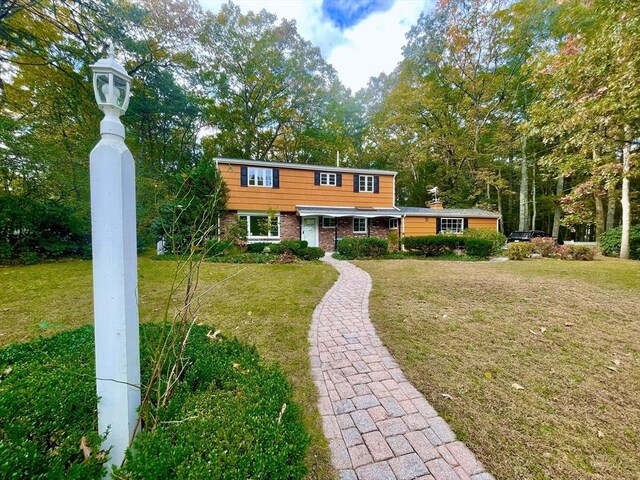17 Brentwood Rd, Sudbury, MA 01776 - view of front of property with a front yard and brick siding