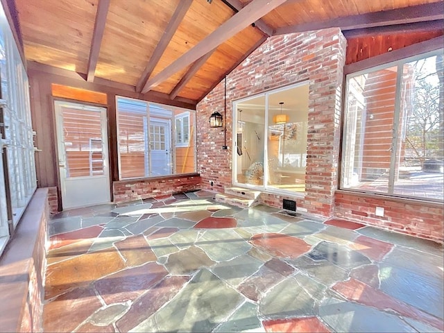 17 Brentwood Rd, Sudbury, MA 01776 - unfurnished sunroom featuring stone floors, wood ceiling, brick wall, and vaulted ceiling with beams