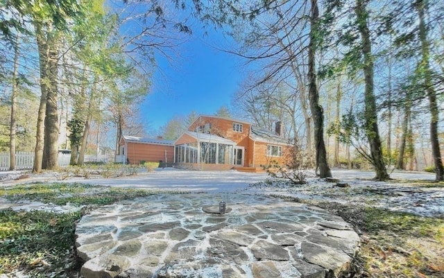 17 Brentwood Rd, Sudbury, MA 01776 - view of front of home featuring a sunroom and a chimney