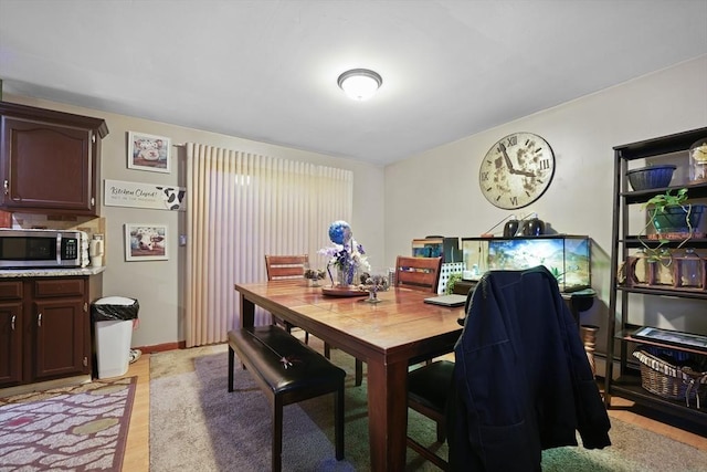 dining room with light wood-type flooring