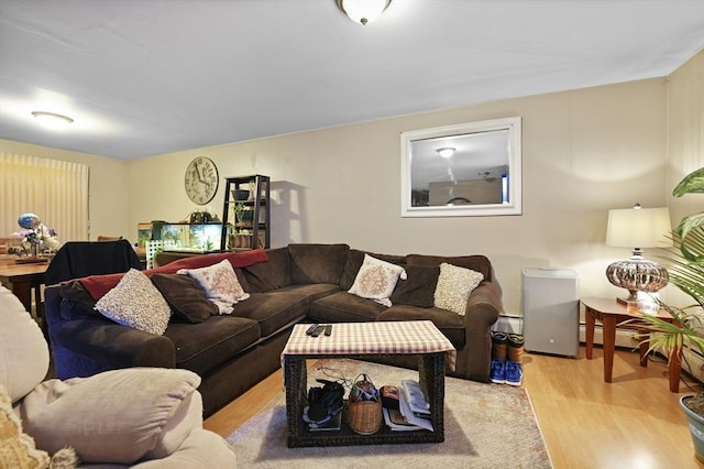 living room featuring light wood-type flooring and a baseboard radiator