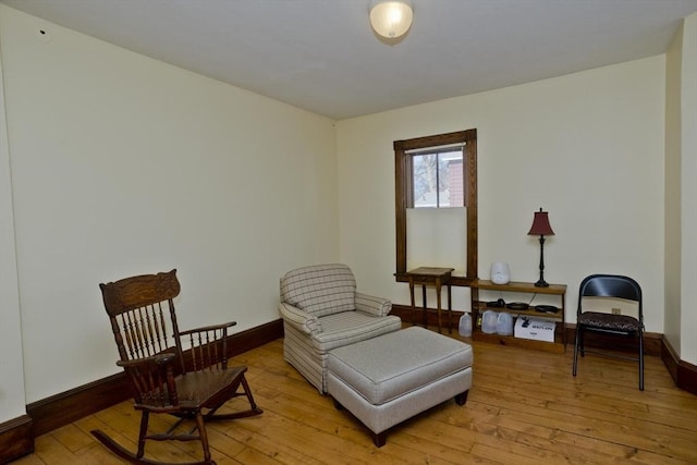 sitting room featuring light hardwood / wood-style floors