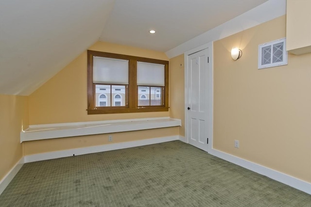 bonus room featuring carpet flooring and lofted ceiling