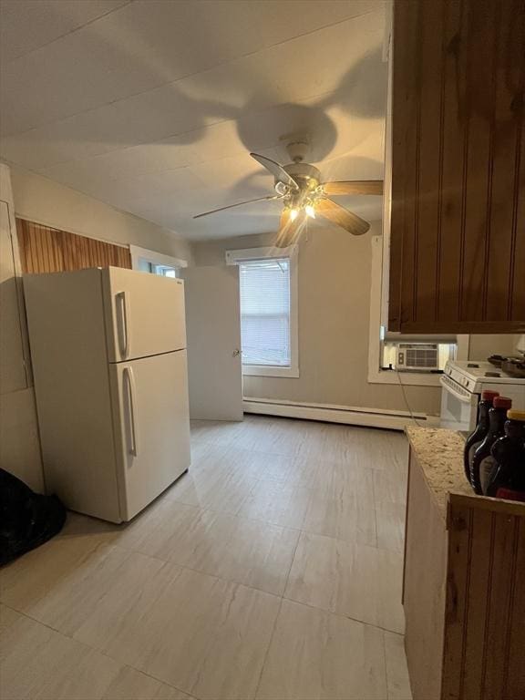 kitchen featuring ceiling fan, a baseboard radiator, and white appliances