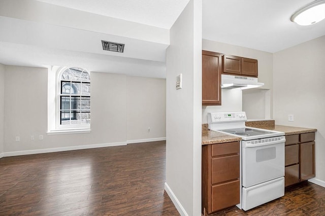 kitchen featuring under cabinet range hood, visible vents, light countertops, brown cabinets, and white electric range oven