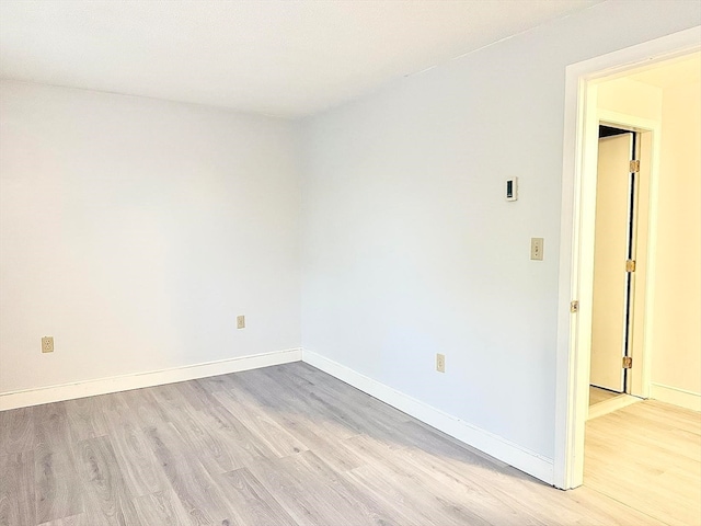 unfurnished room featuring light hardwood / wood-style flooring