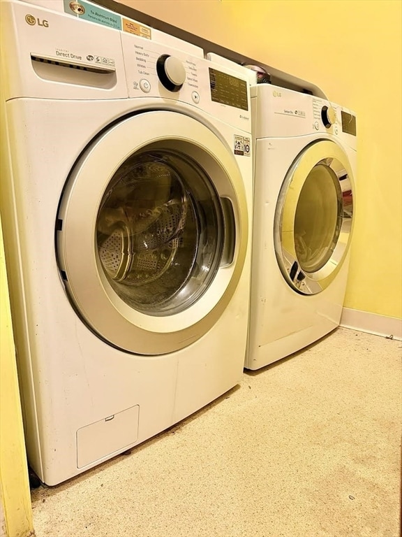 laundry area featuring washing machine and dryer