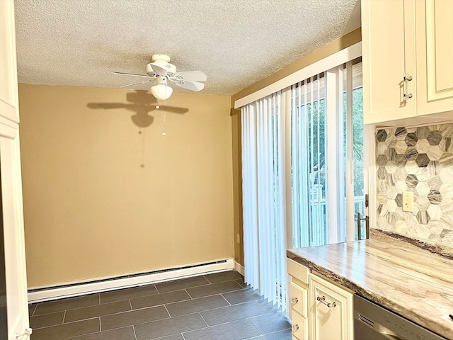 kitchen with ceiling fan, a baseboard radiator, a textured ceiling, and dishwasher