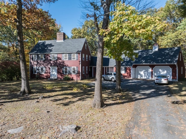 colonial inspired home with a garage