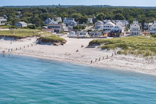 aerial view featuring a water view and a beach view