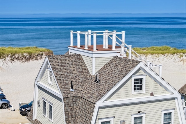 drone / aerial view with a view of the beach and a water view