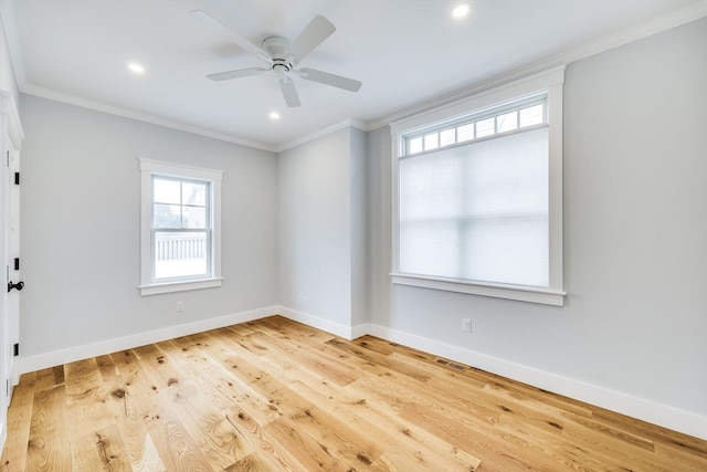 spare room featuring ceiling fan, ornamental molding, and light hardwood / wood-style floors