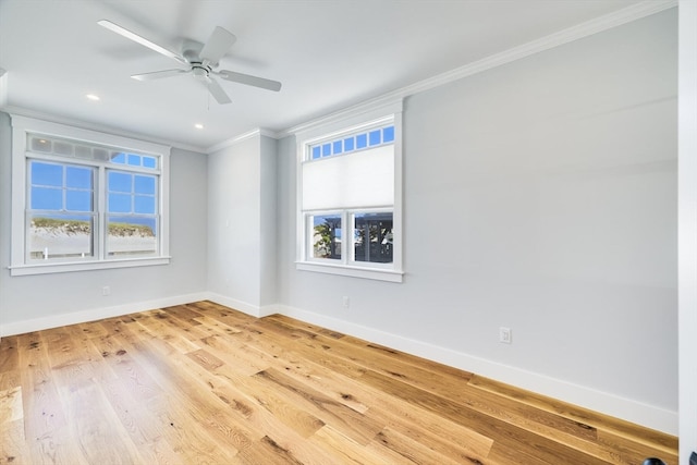 spare room with light wood-type flooring, ceiling fan, and crown molding