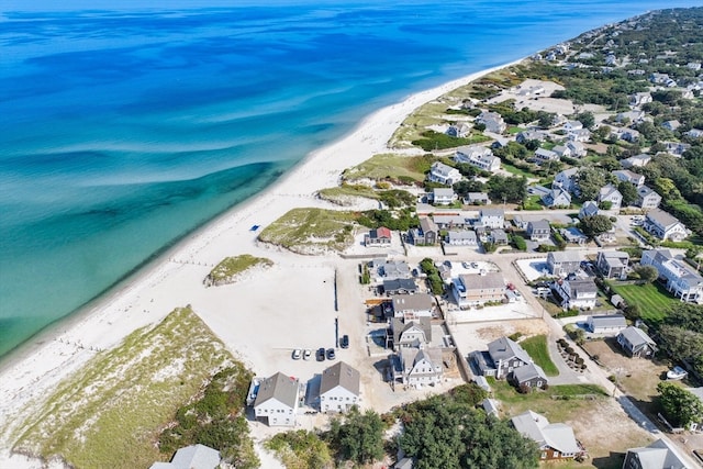 bird's eye view featuring a view of the beach and a water view