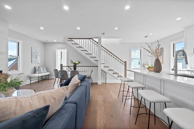 39 Bonner Ave Unit 39, Medford, MA 02155 - living room with stairway, light wood-style floors, plenty of natural light, recessed lighting, and baseboards