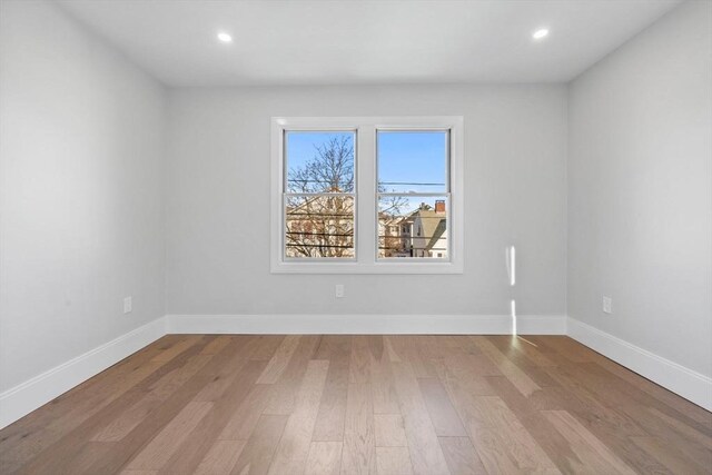 39 Bonner Ave Unit 39, Medford, MA 02155 - empty room featuring light wood-style flooring, recessed lighting, and baseboards