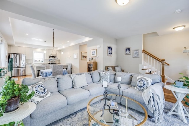 637 Gifford St Unit 4A, Falmouth, MA 02540 - living area with light wood finished floors, stairs, and recessed lighting