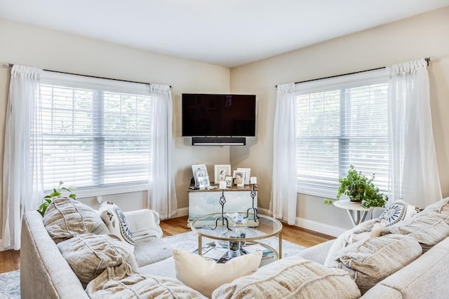 637 Gifford St Unit 4A, Falmouth, MA 02540 - living area featuring healthy amount of natural light and wood finished floors