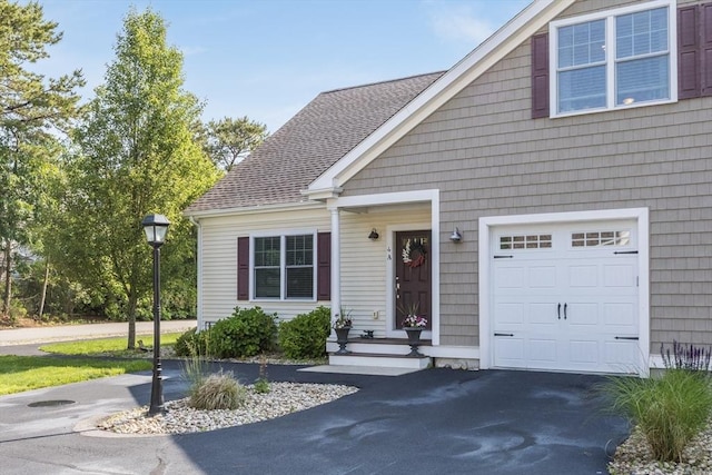 637 Gifford St Unit 4A, Falmouth, MA 02540 - view of front of property featuring asphalt driveway, roof with shingles, and an attached garage