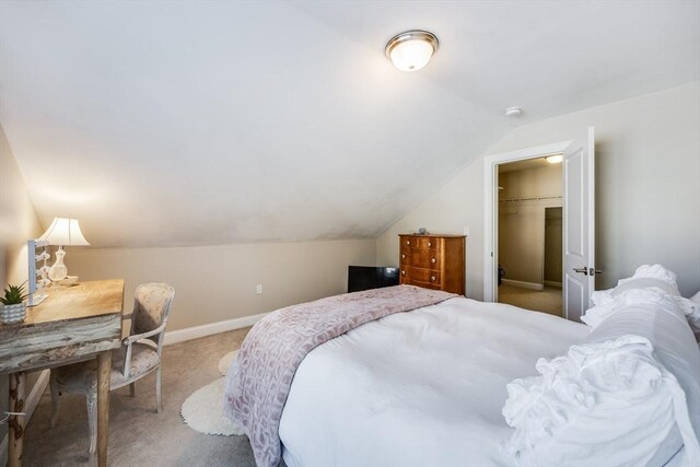 637 Gifford St Unit 4A, Falmouth, MA 02540 - bedroom with carpet floors, vaulted ceiling, and a walk in closet