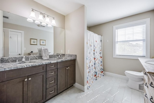 637 Gifford St Unit 4A, Falmouth, MA 02540 - full bathroom featuring double vanity and a shower with curtain